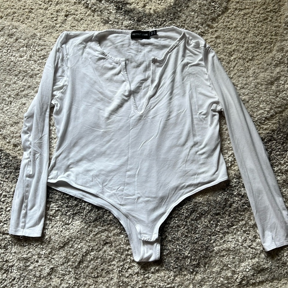 White bodysuit, décolletage neckline